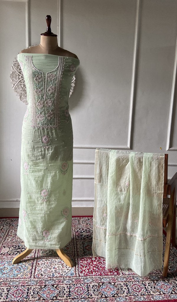 Mint green pure mul chanderi chikankari suit set on the mannequin, dupatta alongside