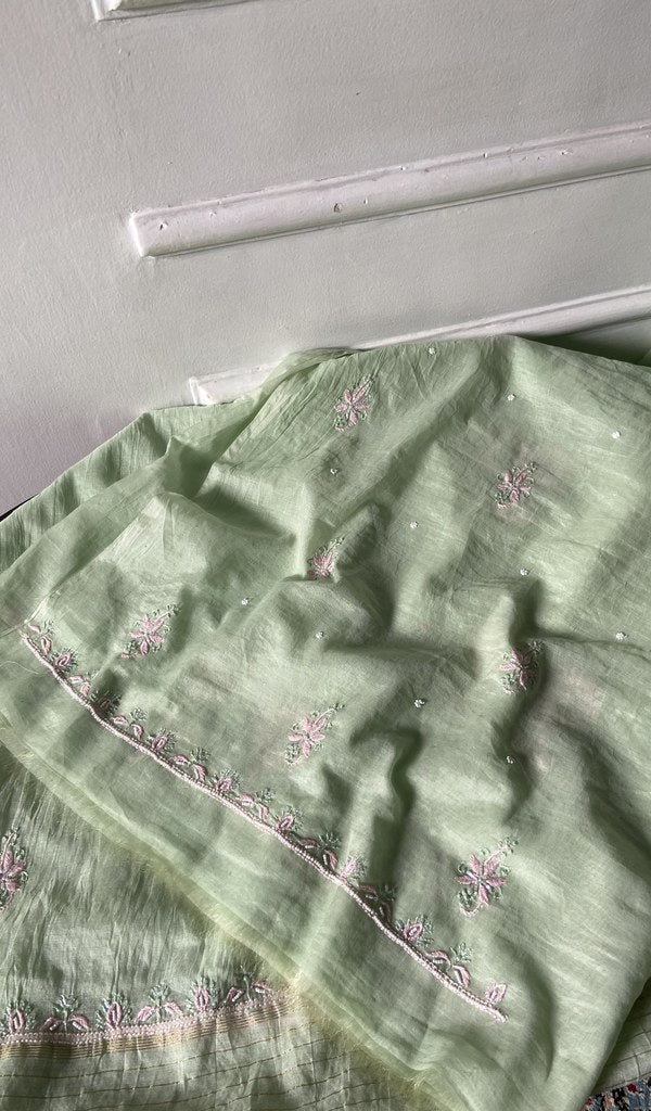 The mint green pieces folded and stacked