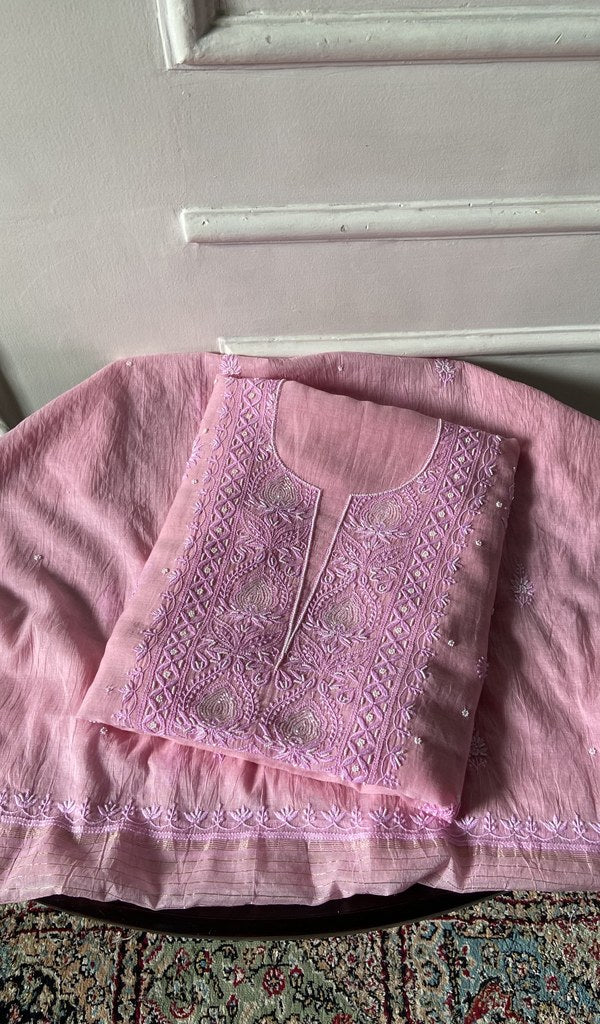 The blush pink pieces folded and stacked