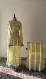 The set on the mannequin with its dupatta beside it
