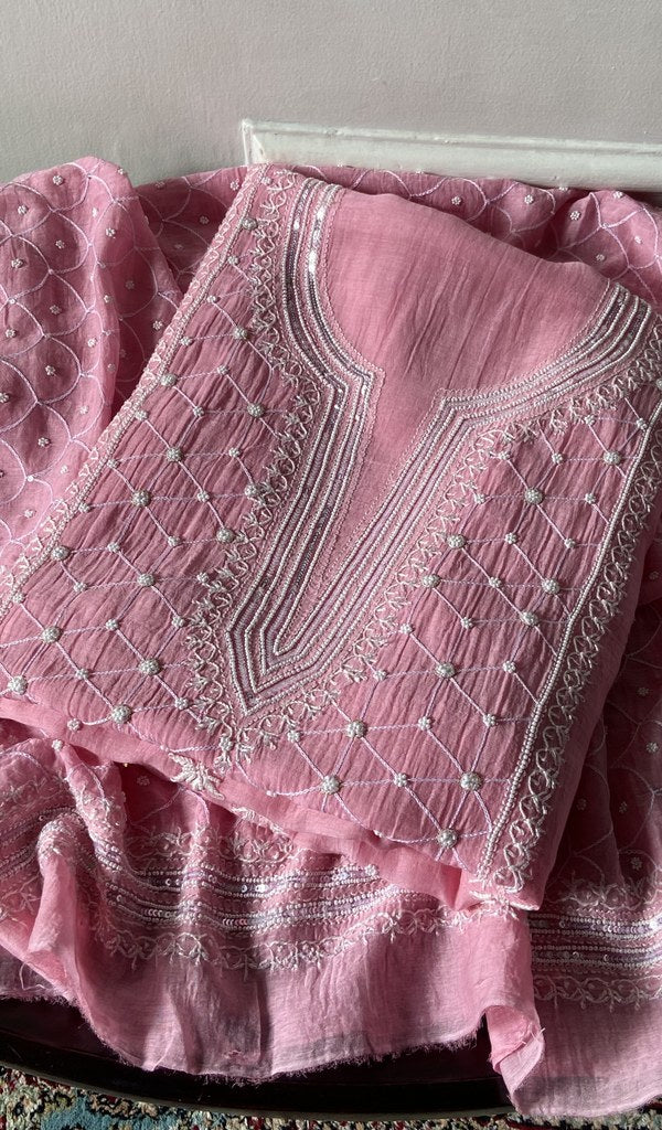 pink chikankari set folded, worked panel on top