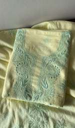 Yellow cotton kurta piece folded, fine contrast chikankari