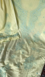 Motifs across the body of the yellow kurta