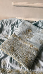 Load image into Gallery viewer, pale blue chikankari set folded, worked panel on top