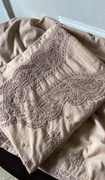 beige pure mul cotton chikankari suit set, folded