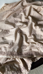 border and hem of the beige kurta piece