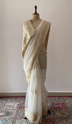 off white pure organza silk chikankari saree draped on the mannequin