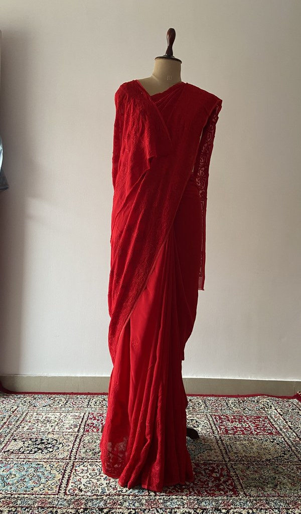 Red viscose georgette saree draped on the mannequin