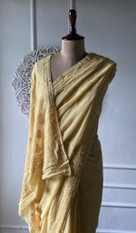 Load image into Gallery viewer, pallu of the yellow viscose georgette saree, resham fine chikankari