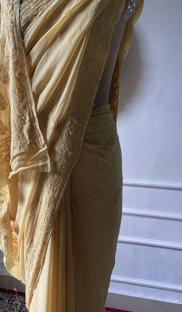 close view of the resham fine chikankari on yellow viscose georgette