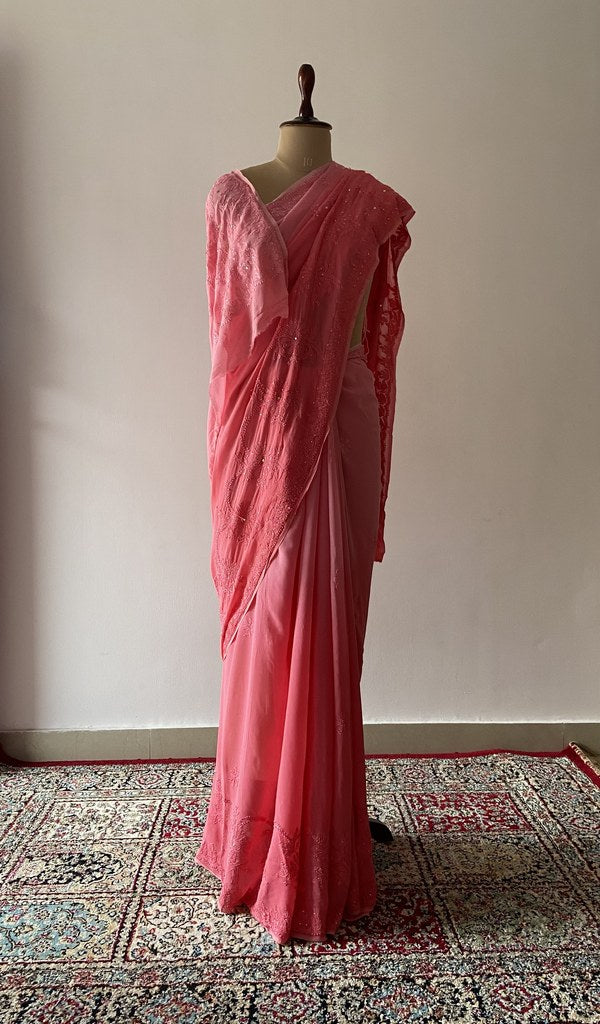 Peach viscose georgette saree draped on the mannequin