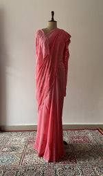 Peach viscose georgette saree draped on the mannequin