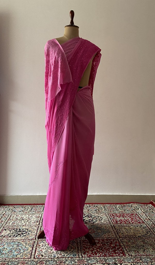 Pink viscose georgette saree draped on the mannequin