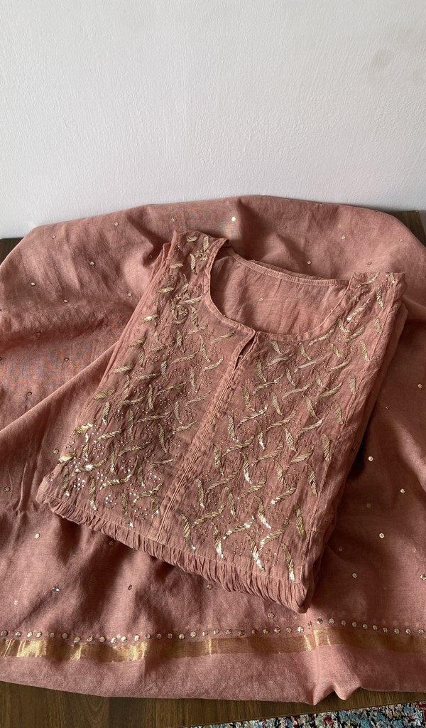 Folded brown pure mul chanderi kurta piece with chikankari on the panel