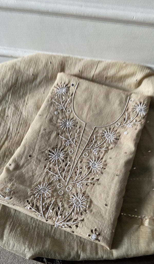 beige pure mul chanderi kurta piece folded, badla work and beadwork