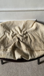 Bottom fabric draped over the stool
