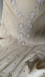 badla work and beadwork across the body of the kurta