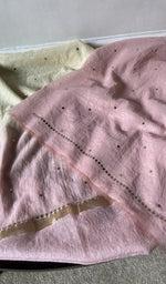 border and hem of the pink kurta piece