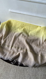 fabric laid out, yellow pure mul chanderi