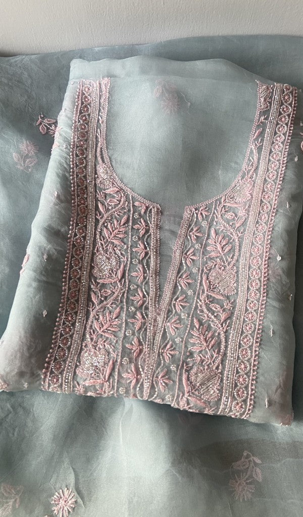 Blue pure organza silk kurta piece folded, fine do taar and teen taar chikankari