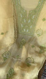 Yellow pure organza silk kurta piece folded, fine do taar and teen taar chikankari
