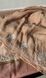 border and hem of the beige kurta piece