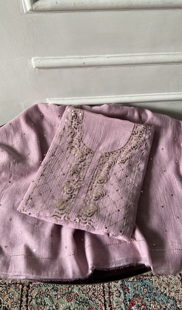 The lilac pieces folded and stacked
