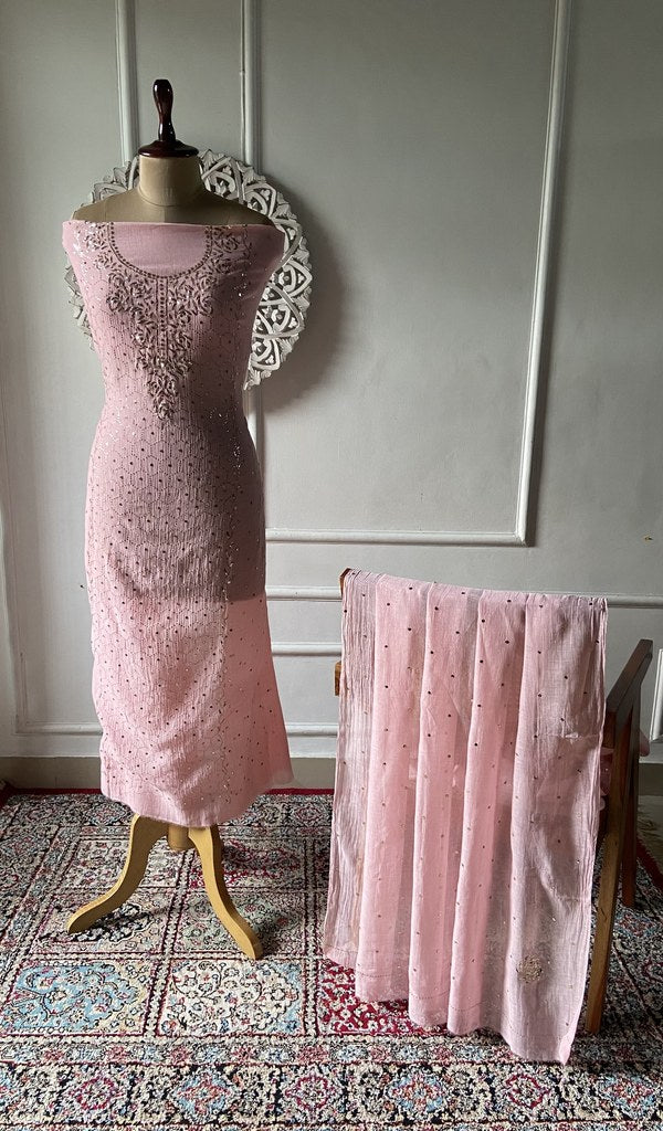 Rose pink pure mul chanderi chikankari suit set on the mannequin, dupatta alongside
