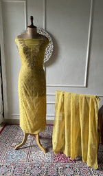 将图像加载到图库查看器中， Yellow pure mul chanderi chikankari suit set on the mannequin, dupatta alongside