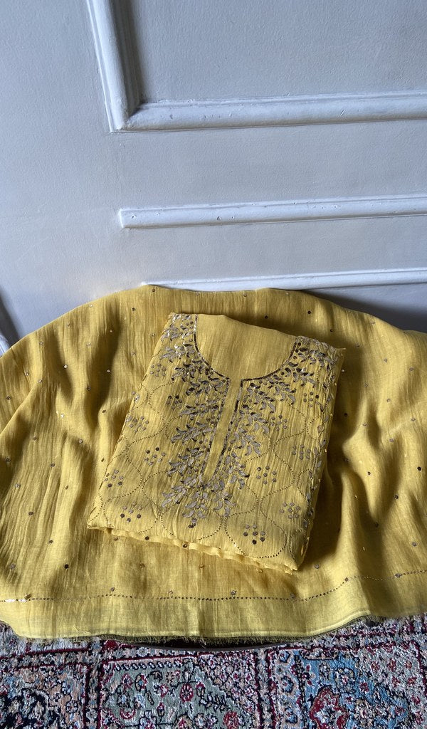 The yellow pieces folded and stacked