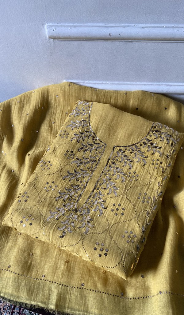 Folded yellow pure mul chanderi, gala panel showing