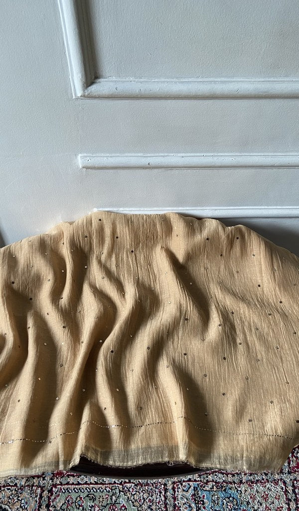 Beige pure mul chanderi laid over the stool
