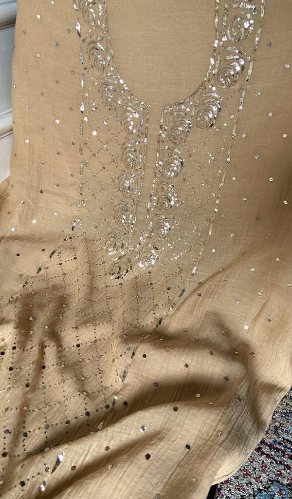 Close view of the chikankari on the beige kurta