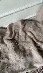 Mauve kurta piece laid out, work across the body