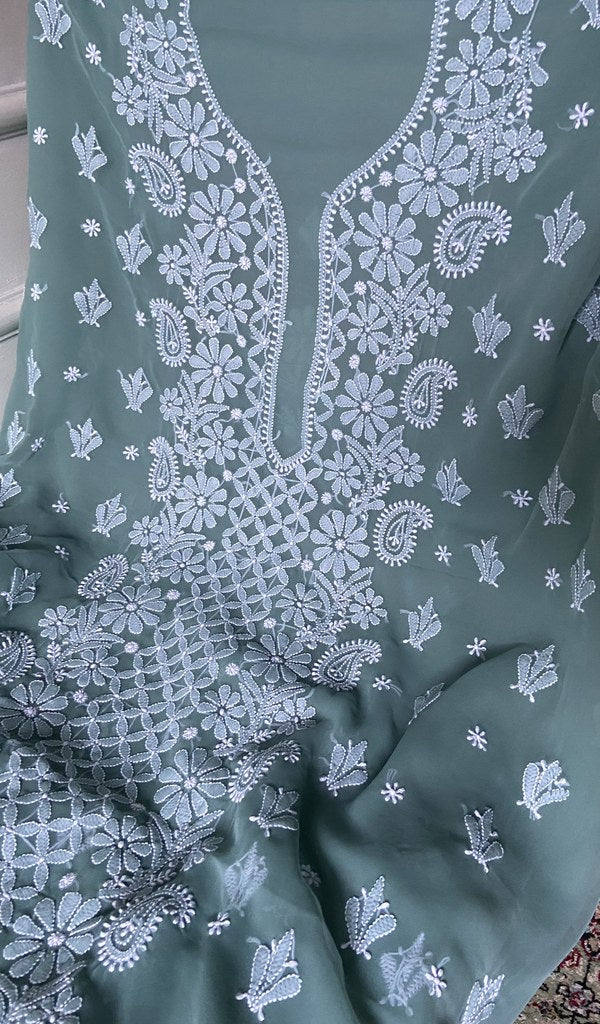 close view of the hand embroidery, sea green faux georgette