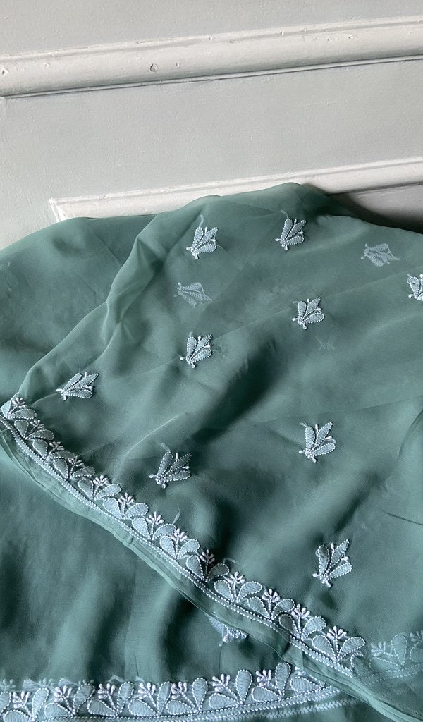 border and hem work on sea green faux georgette