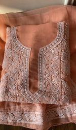 Folded peach faux georgette kurta, front view