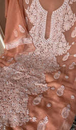 Peach faux georgette laid out flat
