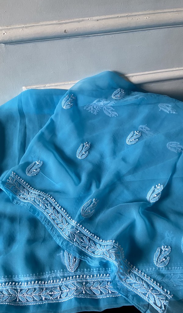 border and hem work on turquoise faux georgette