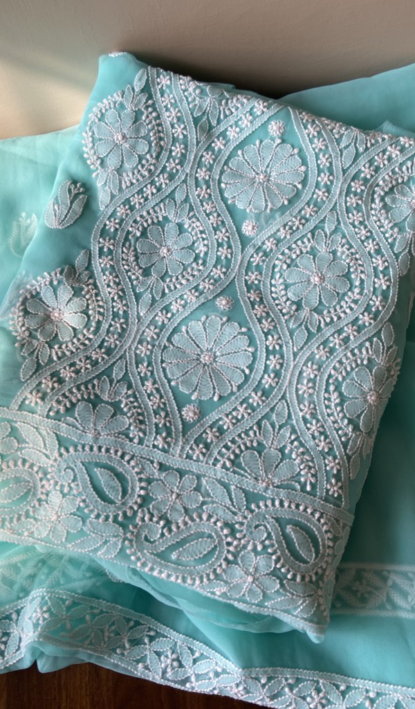 Folded aqua faux georgette kurta, front view