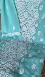 Aqua faux georgette laid out flat