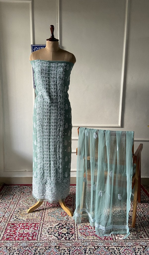 sage green faux georgette chikankari 3 pc unstitched suit set on mannequin