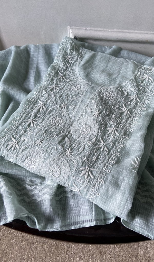 green pure kota cotton chikankari suit set, folded
