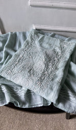 border and hem of the green kurta piece