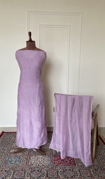 Lilac muslin set on the mannequin with its dupatta