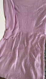 Lilac muslin laid flat on the table