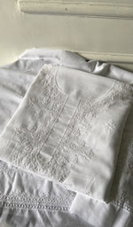 white cotton kurta piece folded, fine chikankari with haath ki jaali