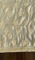 The cream kurta, spread out flat