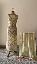 Yellow pure mul chanderi chikankari suit set on the mannequin with its dupatta