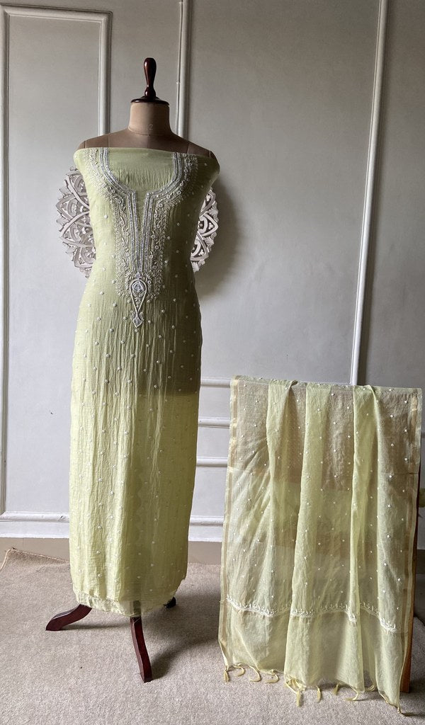 Pale Lime suit set on the mannequin with its dupatta
